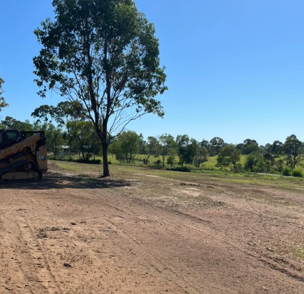 Cleared paddock after tree removal and skid steer clean-up — Moreton Bay