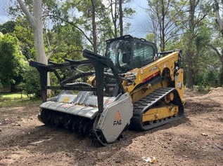 CAT skid steer with FAE forestry mulcher clearing scrub — Sunshine Coast